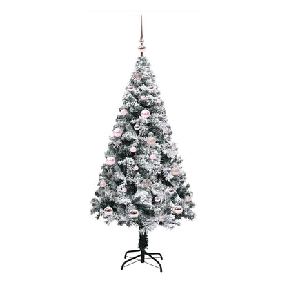 The white artificial Christmas tree with pink baubles and a metal stand