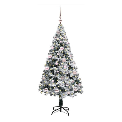 The white artificial Christmas tree with pink baubles and lights, standing on a black metal base
