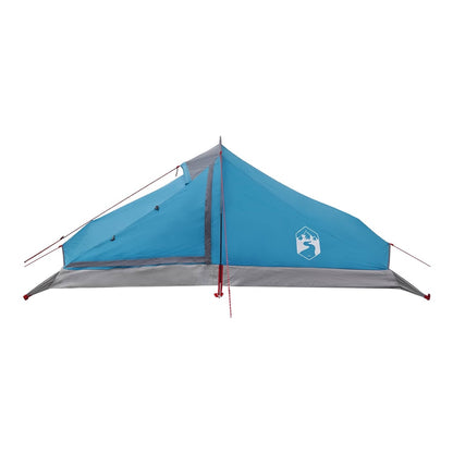 The blue backpacking tent is shown from the front with guy ropes extended