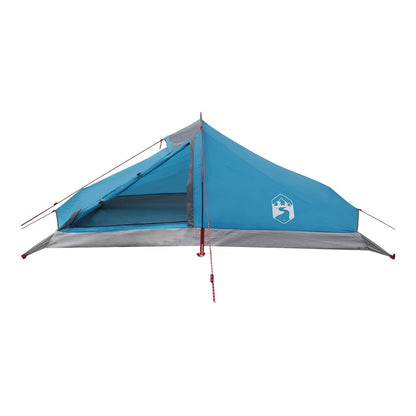 The blue backpacking tent is shown from the front with guy ropes attached
