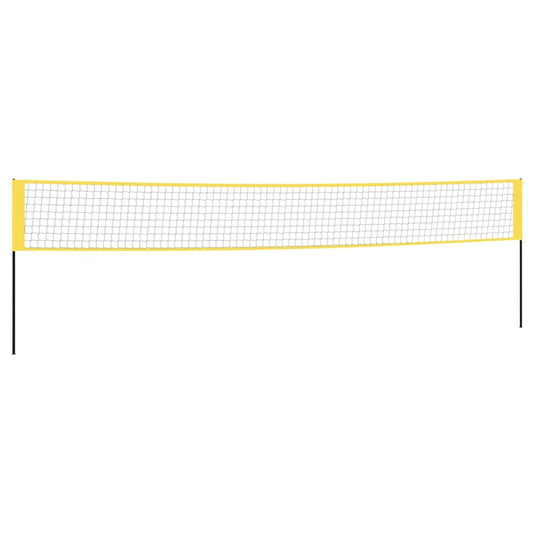 The yellow and black badminton net stretched between two poles on a sports court