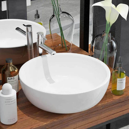 Basin Round Ceramic White in a stylish bathroom setting with a chrome tap and decorative bottles