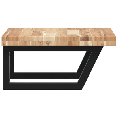 Close up of the solid wood top and black metal brackets of a bathroom vanity unit