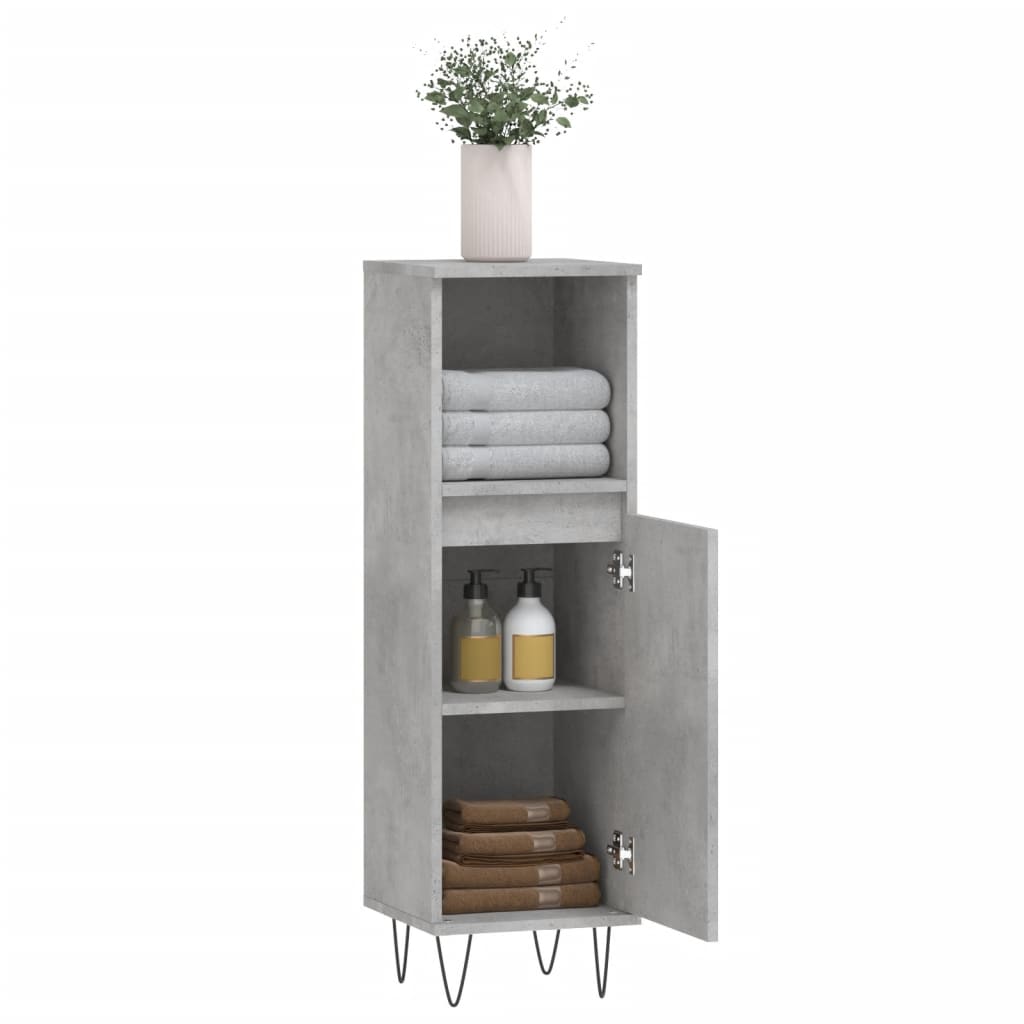 The open cabinet showing shelves and storage space, with towels and bottles
