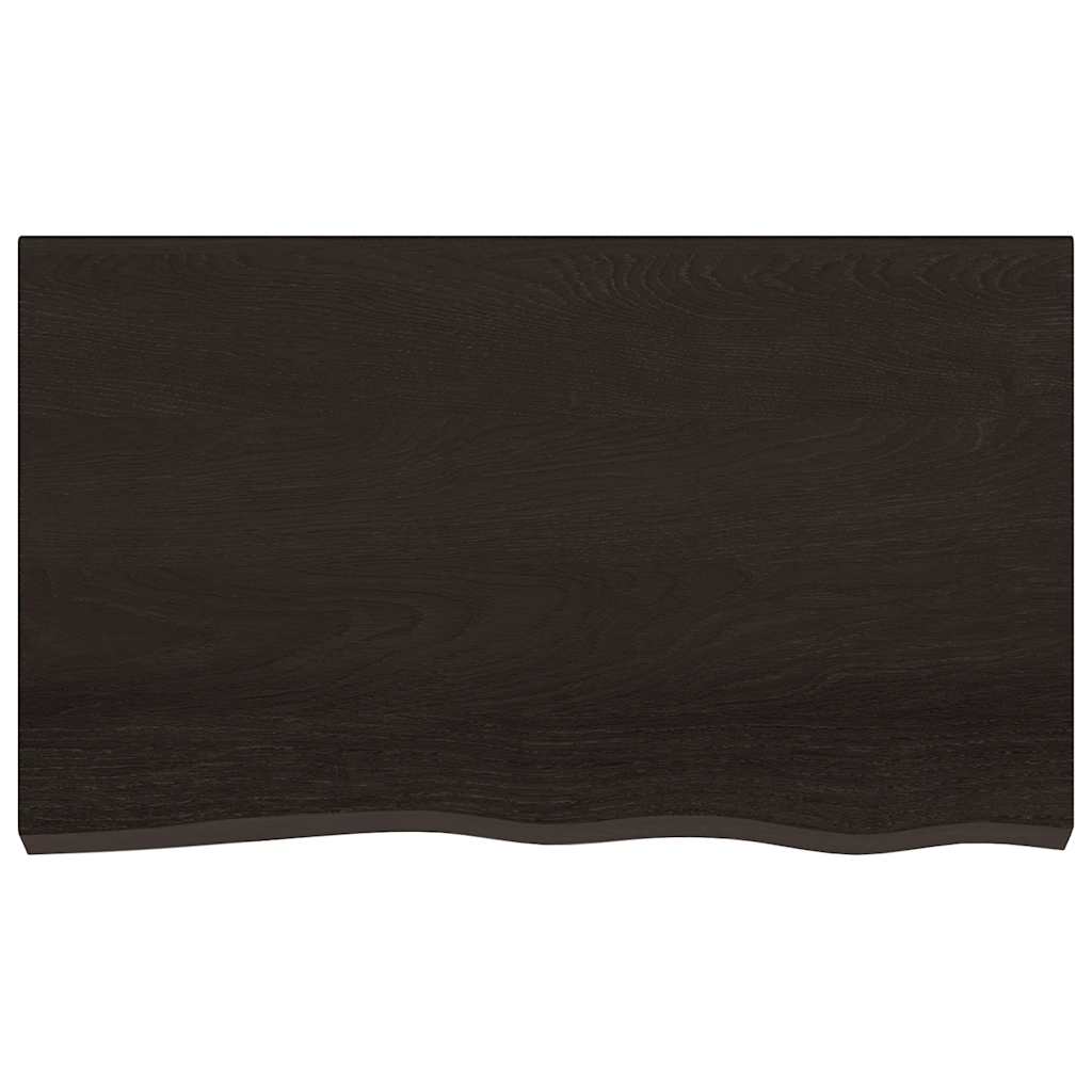 The dark brown bathroom worktop viewed directly from above showing the wood grain texture