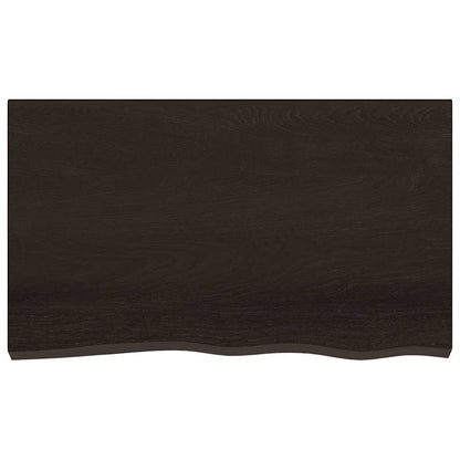 The dark brown bathroom worktop viewed directly from above showing the wood grain texture