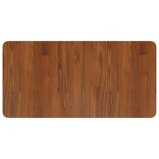 The dark brown wooden worktop showing the grain pattern of the solid wood surface