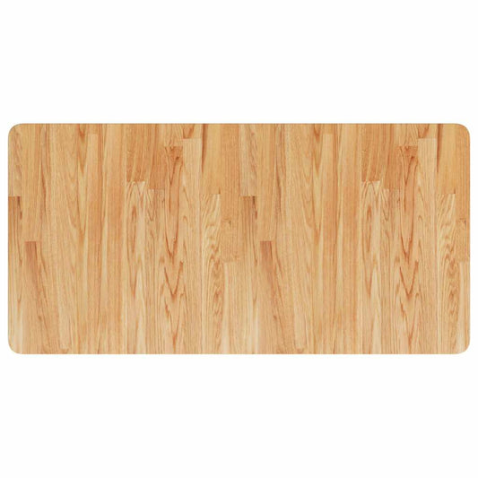 the light brown wooden worktop showing the wood grain pattern and construction