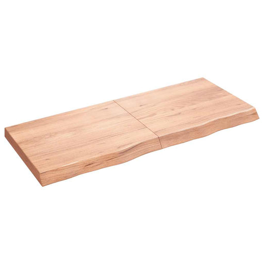 Light brown solid wood countertop with a natural live edge