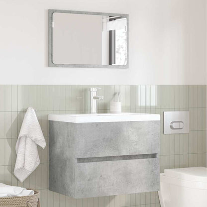Concrete grey bathroom vanity unit with a drawer and a mirror in a bathroom setting