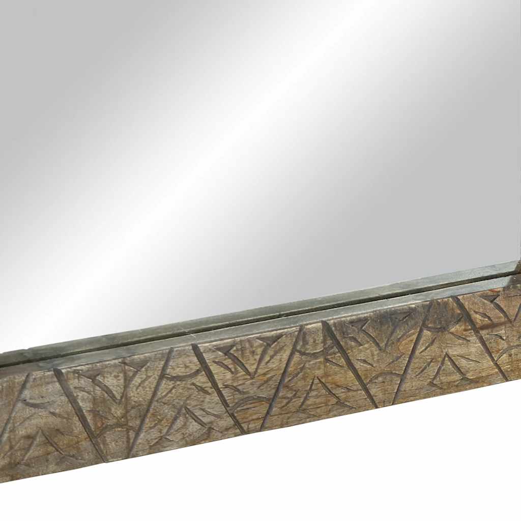 A close-up of the bottom edge of the bathroom mirror showing the wood texture