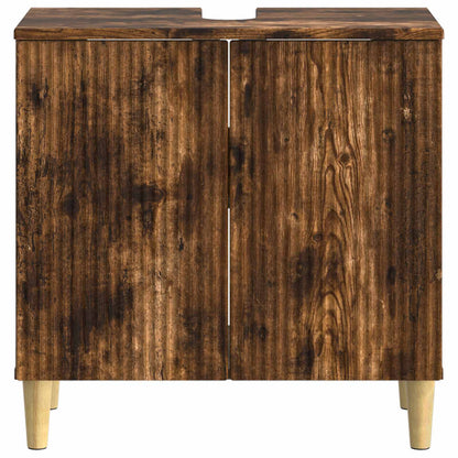 The bathroom sink cabinet shown from the front with closed doors and light wooden legs