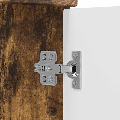 A close-up of the metal hinge mechanism attached to the wooden cabinet door