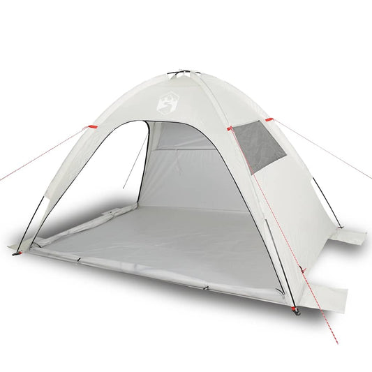 The grey waterproof beach tent is shown from a slightly elevated side angle on a sandy surface
