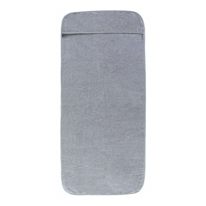A single grey beach towel with a pocket at the top, laid flat
