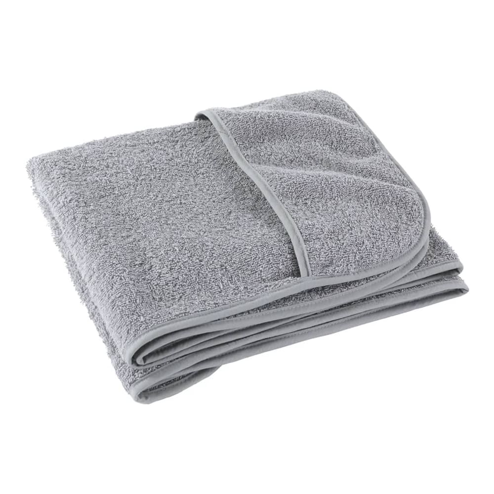 A folded grey beach towel showing its textured fabric and hemmed edge