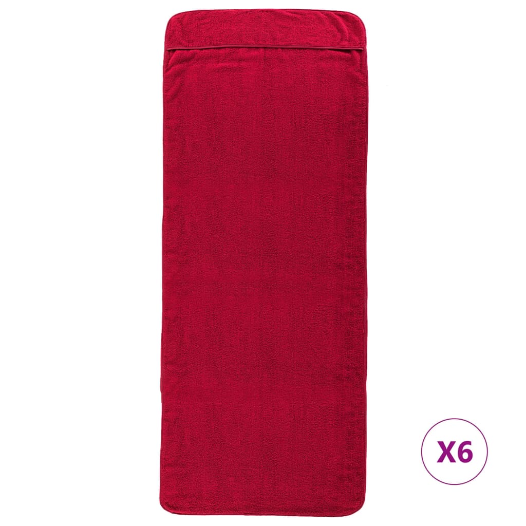 The beach towels laid flat showing the full rectangular shape and deep burgundy colour