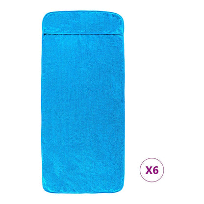 a folded turquoise beach towel with a pocket at the top