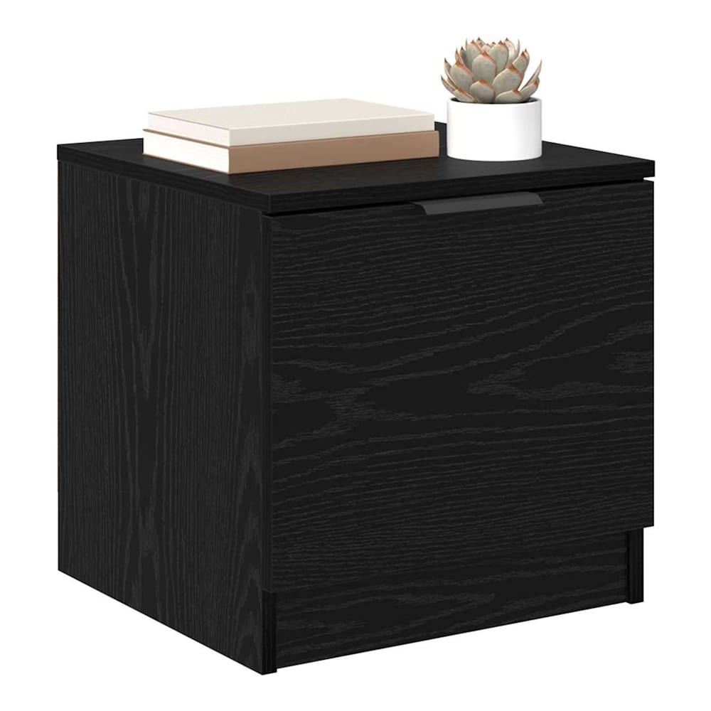 Close-up of a black oak bedside table showing the wood grain texture and handle