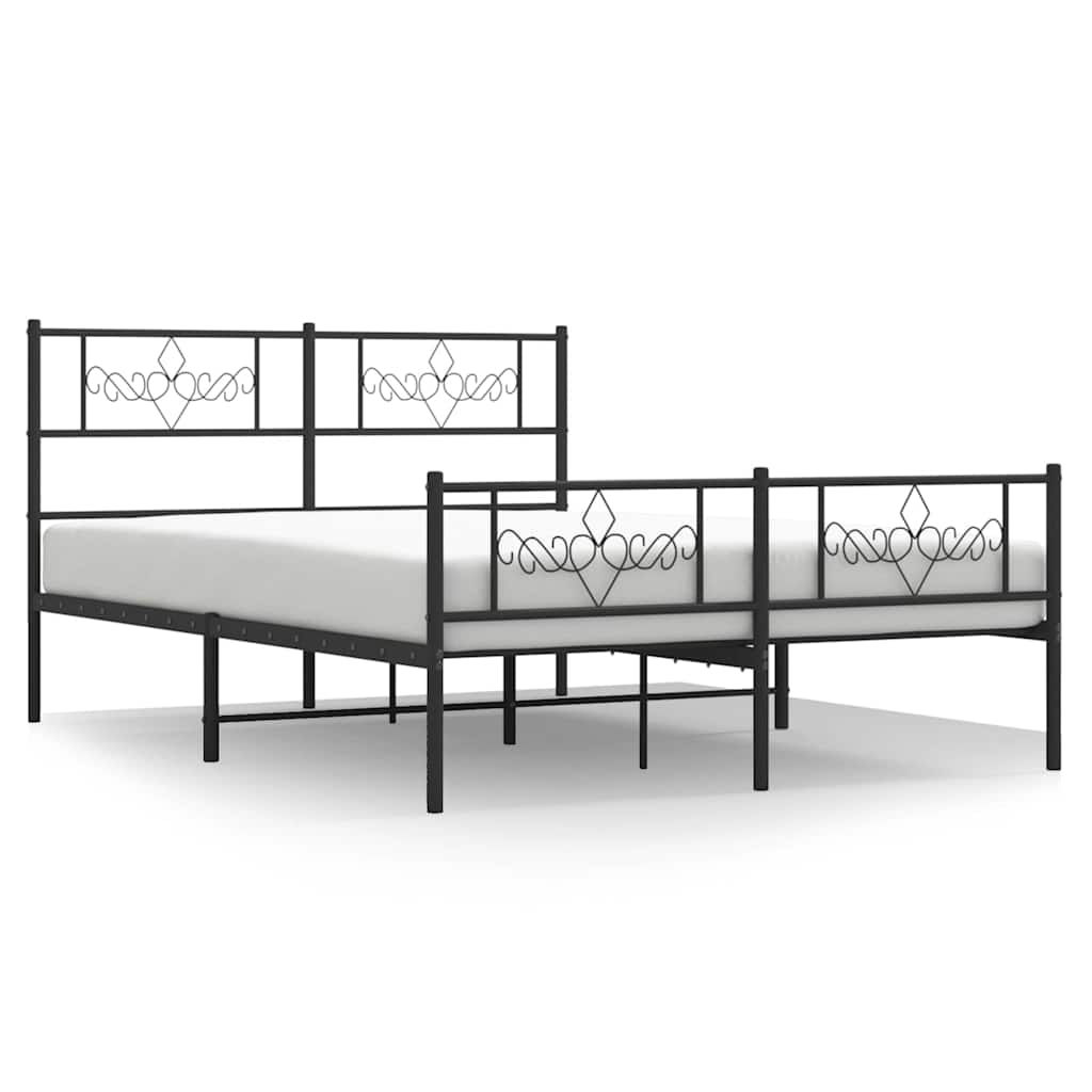 The black metal bed frame with a mattress, showing the decorative headboard and footboard detail