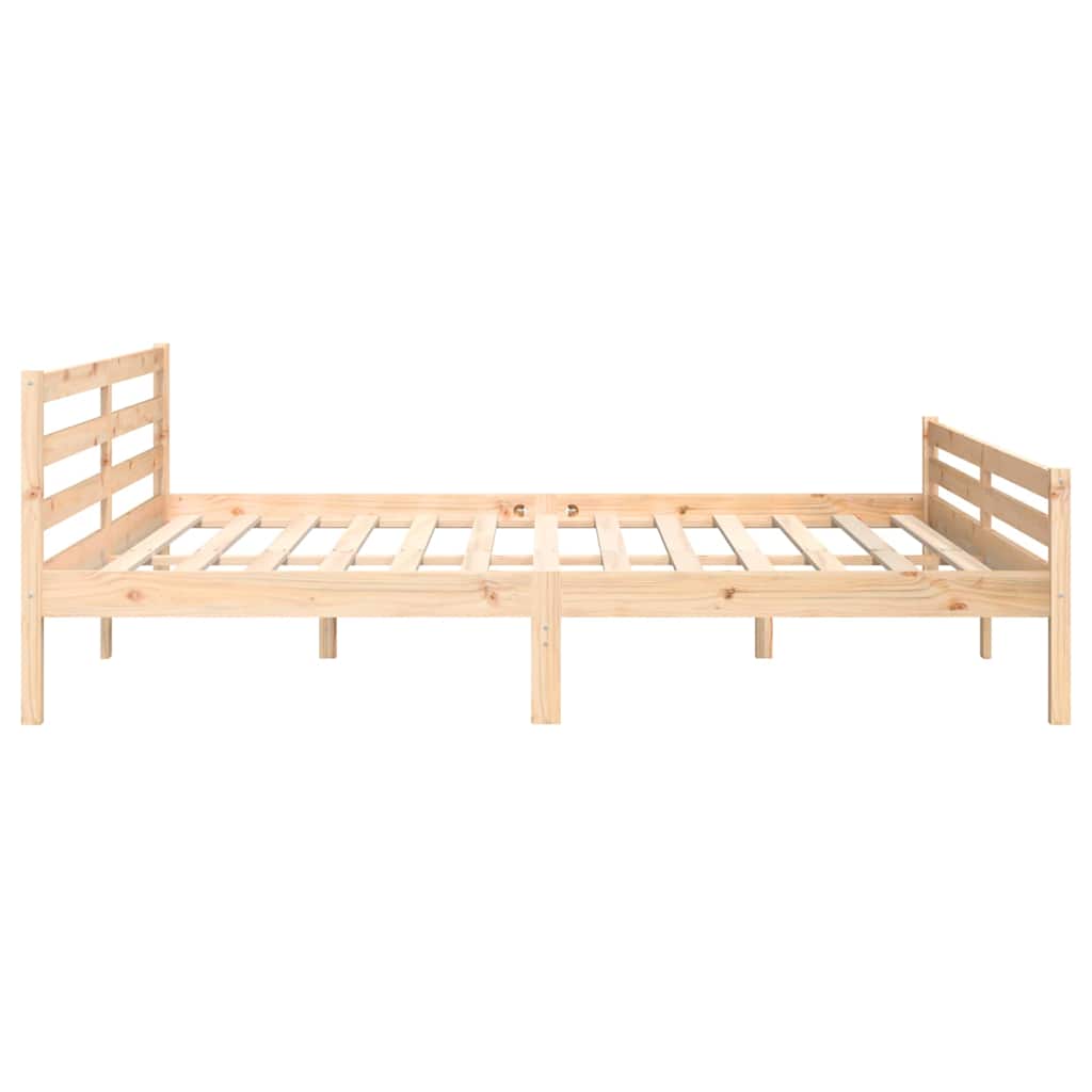 The solid wood bed frame shown from the back with two mattresses