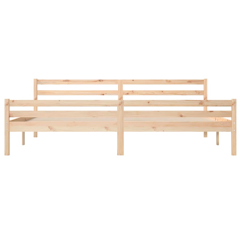 The wooden bed frame shown from the front with two mattresses