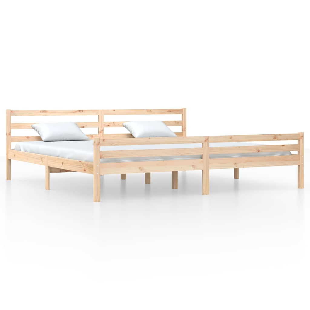The solid wood bed frame shown from the side with two mattresses