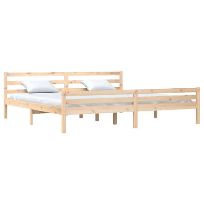 The wooden bed frame shown from the side with two mattresses