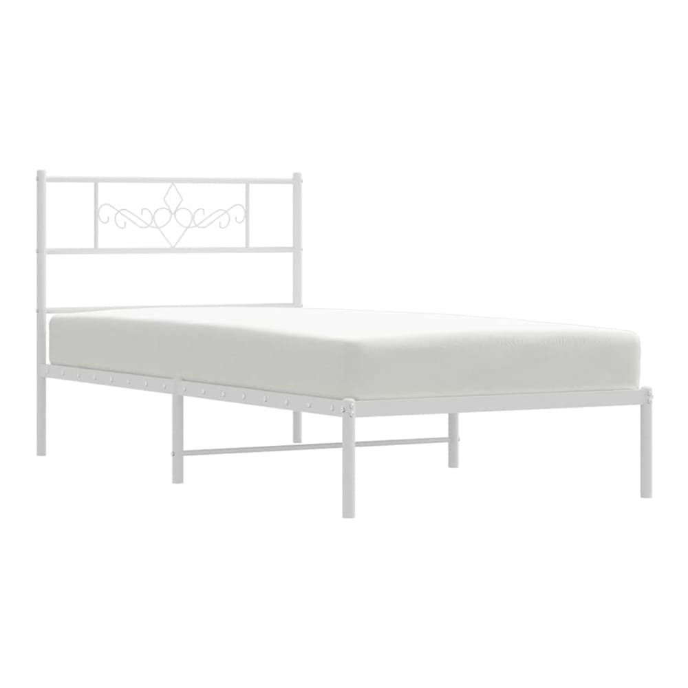 The white metal bed frame with mattress