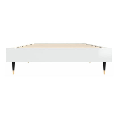 the white high gloss bed frame without mattress from a side angle showing the legs