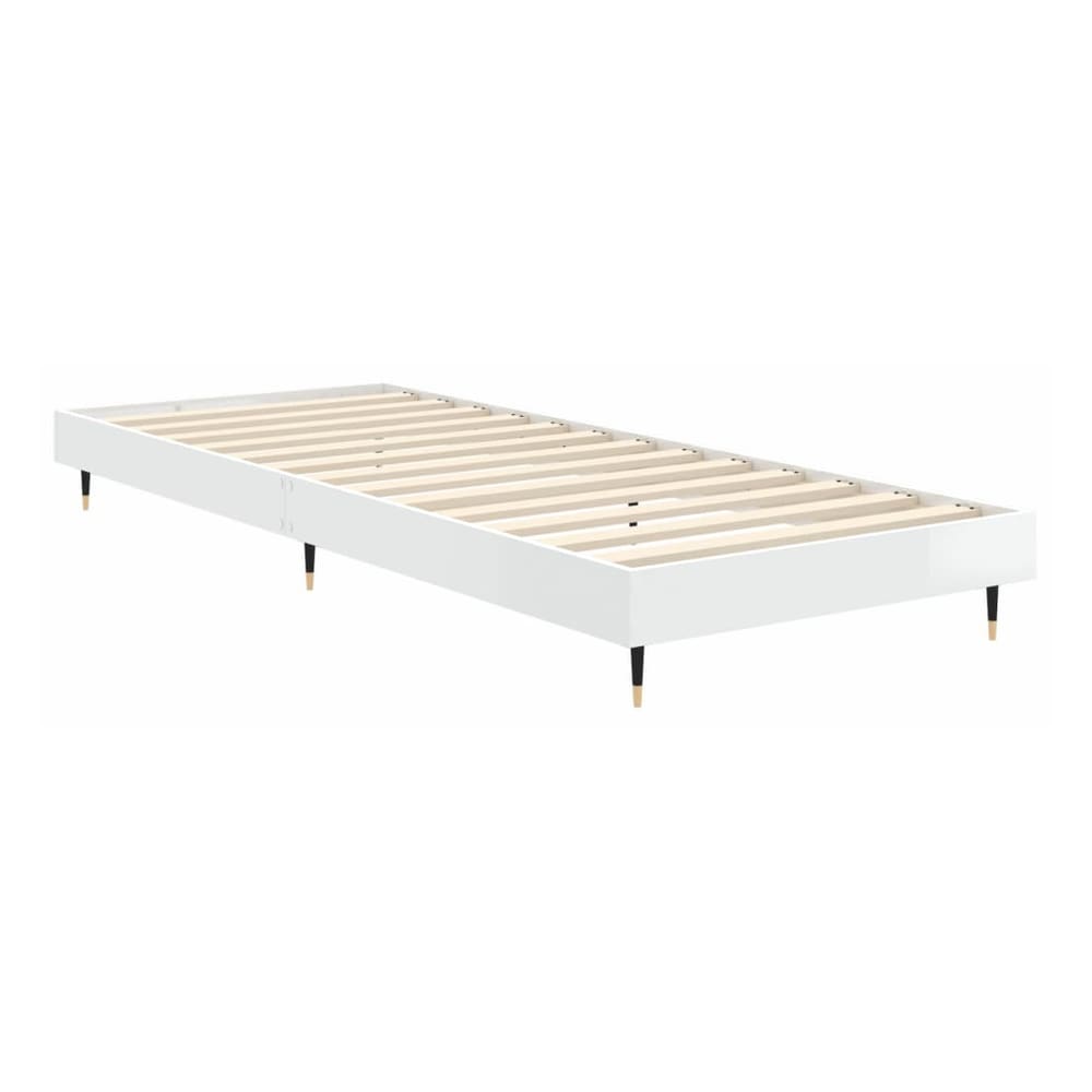 the white high gloss bed frame without mattress with the wooden slats visible