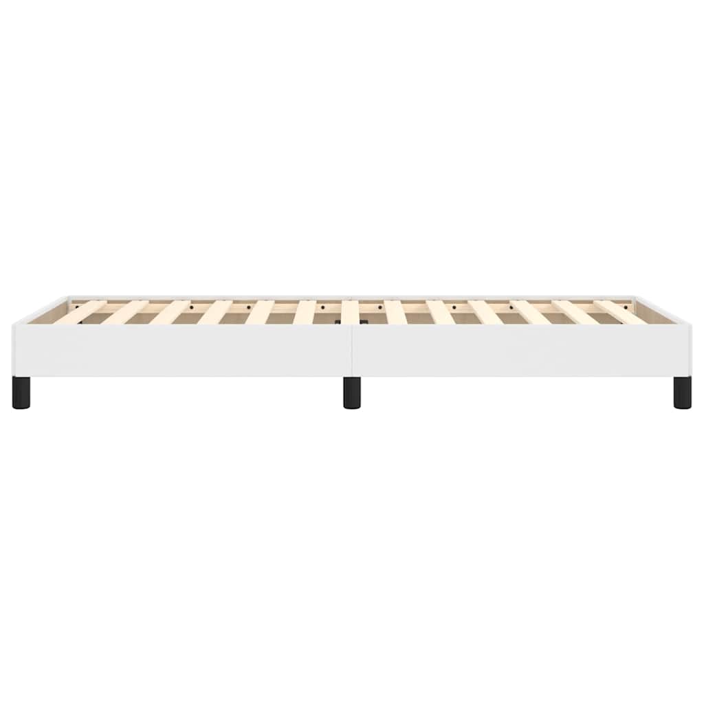 The white single bed frame from the side showing the wooden slats