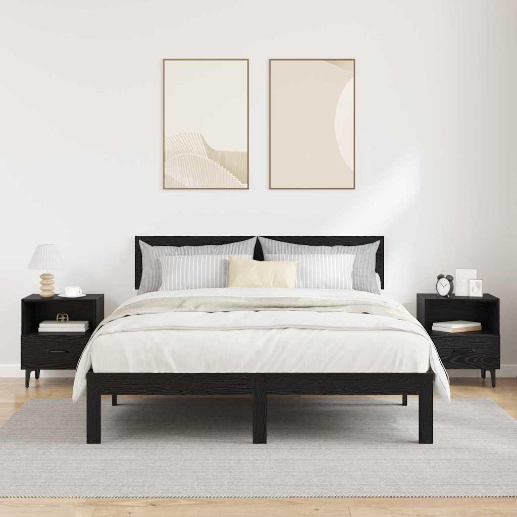 Bedroom scene with a bed and two black oak bedside tables