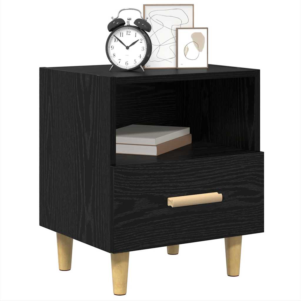 The bedside table featuring an open shelf and a drawer with a light wooden handle
