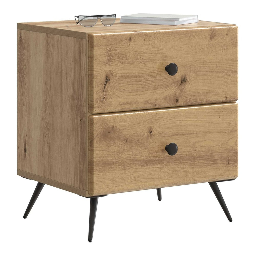 The bedside cabinet with a book and glasses on top