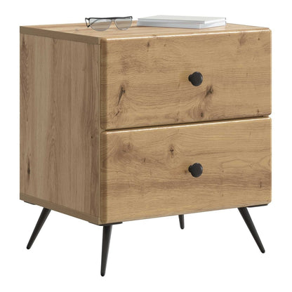 The bedside cabinet with a book and glasses on top