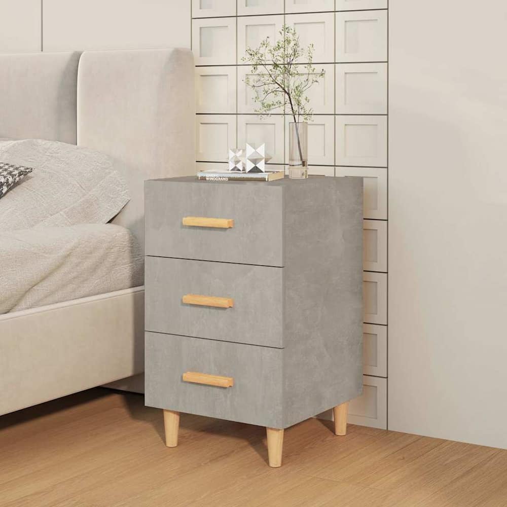 Bedside table in concrete grey finish next to a bed in a bedroom setting
