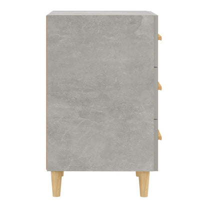 Side view of a concrete grey bedside cabinet with wooden legs and handles