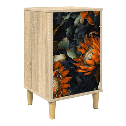 bedside cabinet with a floral design on the drawers and wooden legs