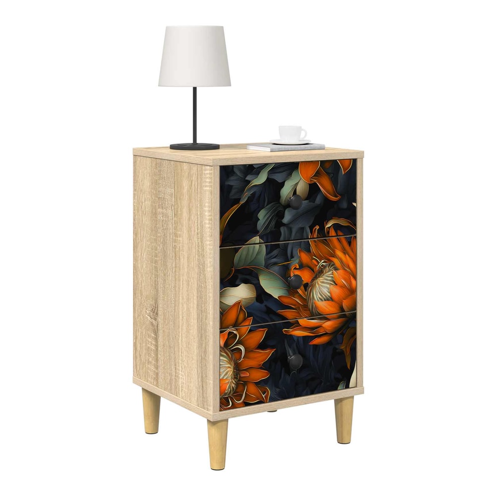 bedside table with a lamp and a cup on top, floral drawers