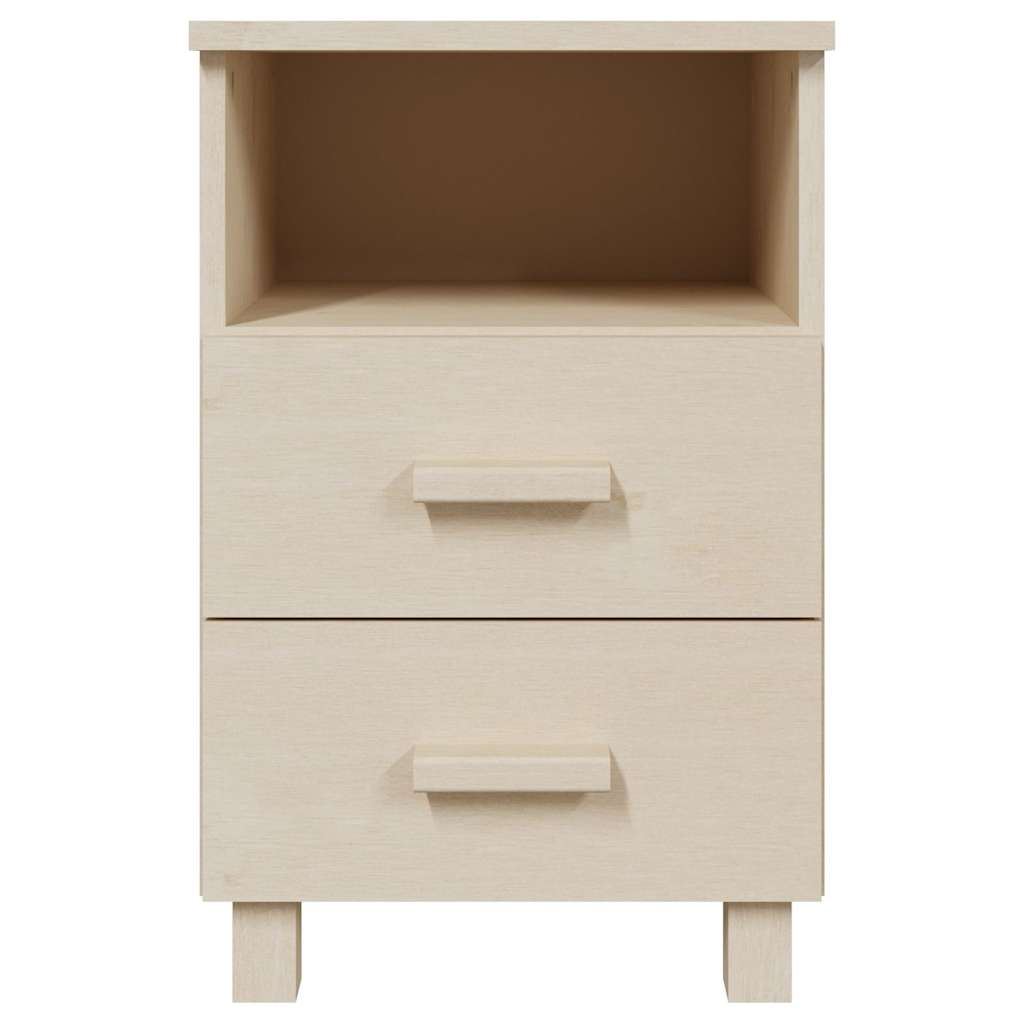 Close up of a honey brown solid wood bedside cabinet showing drawer detail
