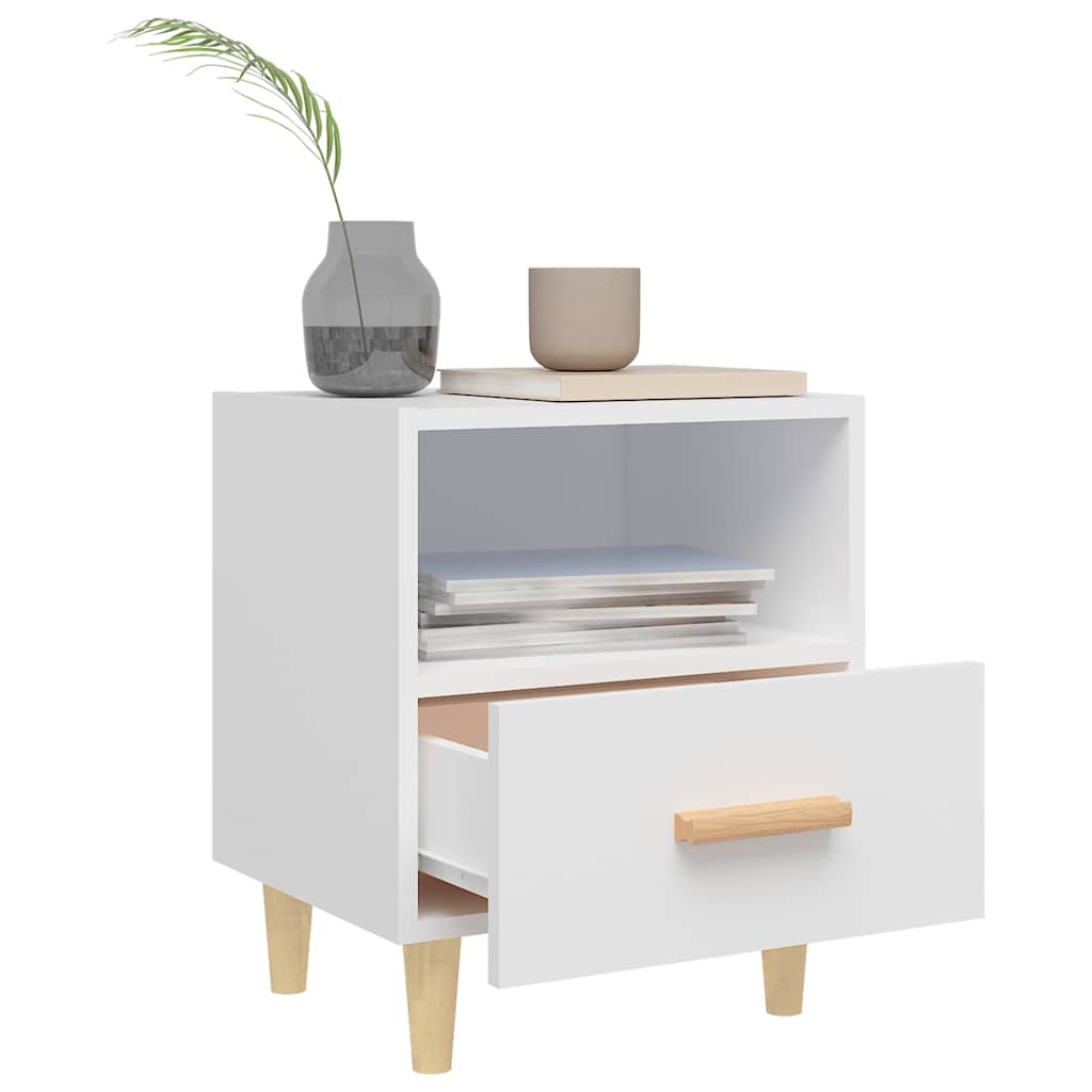 A white bedside table with an open drawer and a vase on top