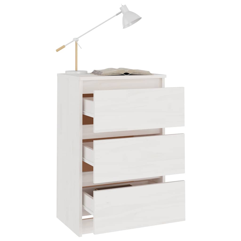 The bedside table with all three drawers pulled open and a lamp on top
