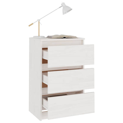 The bedside table with all three drawers pulled open and a lamp on top