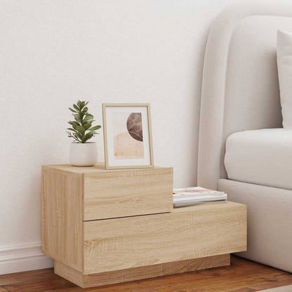 Bedside cabinet with LED lights in a bedroom setting next to a bed