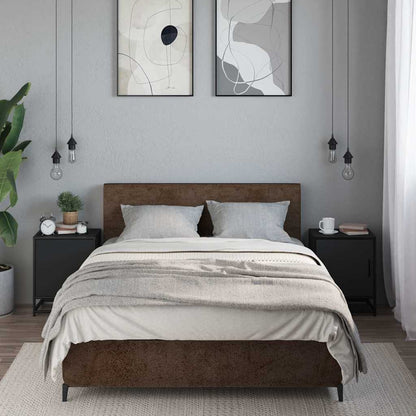 Two black bedside cabinets in a bedroom setting next to a bed