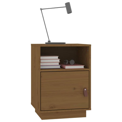 A honey brown solid wood pine bedside cabinet with books and glasses