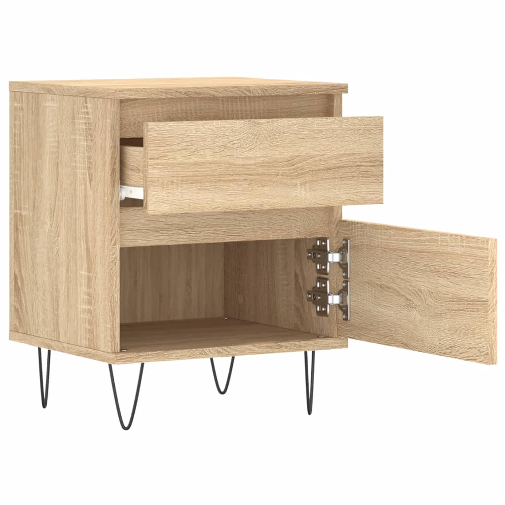 The bedside table with the top drawer pulled out and the bottom door open