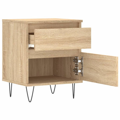 The bedside table with the top drawer pulled out and the bottom door open