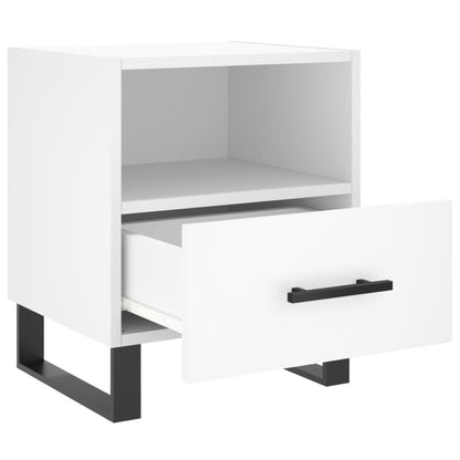 Close-up of a white bedside cabinet with the drawer pulled out